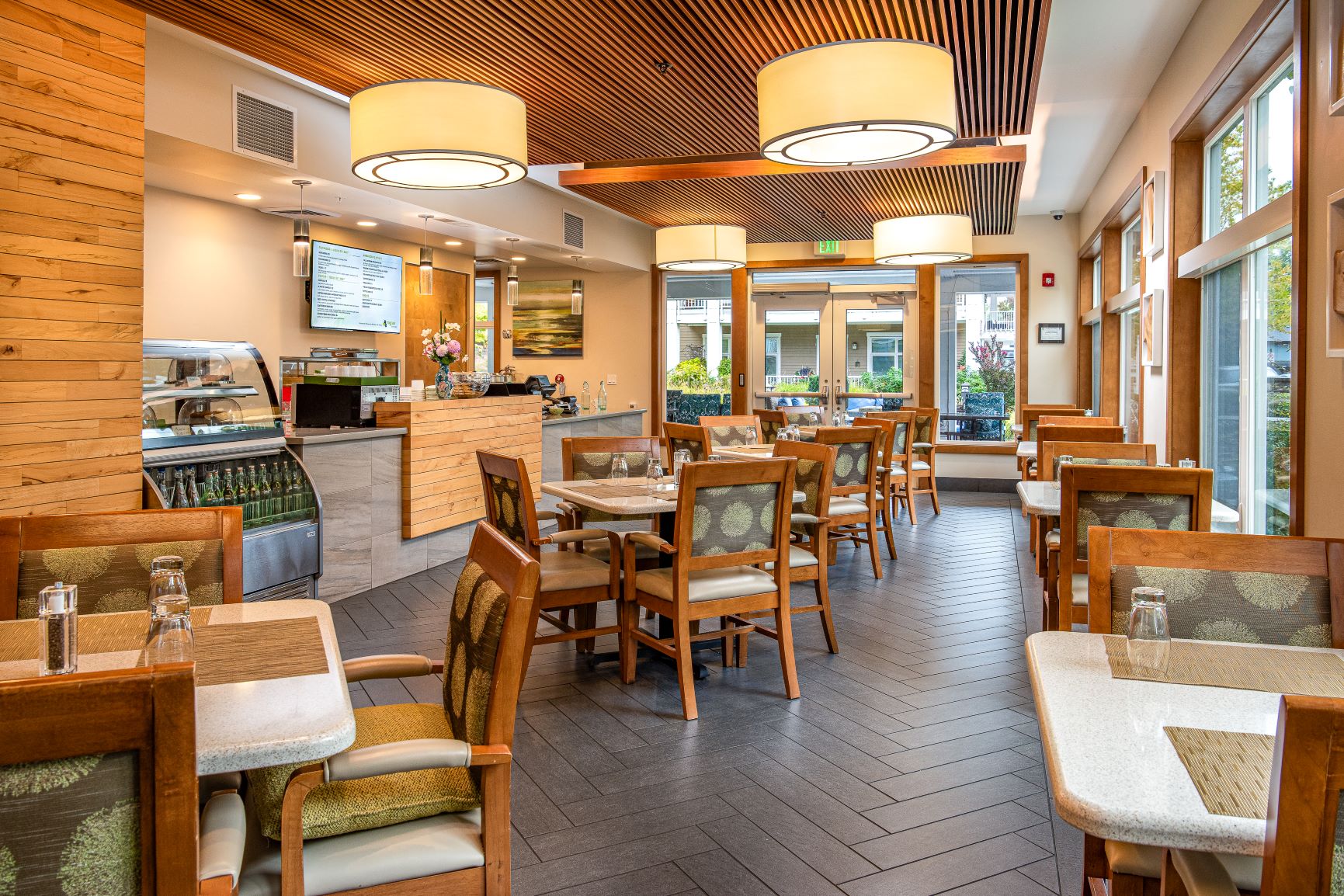 A bistro restaurant with tables and chairs and a counter